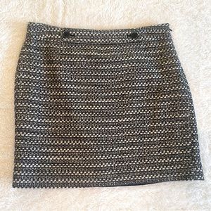Loft-lined black print mini skirt, size 6.